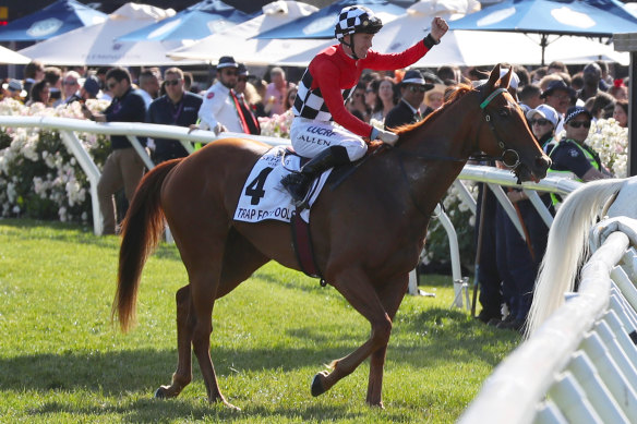 Trap For Fools ridden by jockey John Allen returns to the mounting yard after winning the Mackinnon Stakes. 