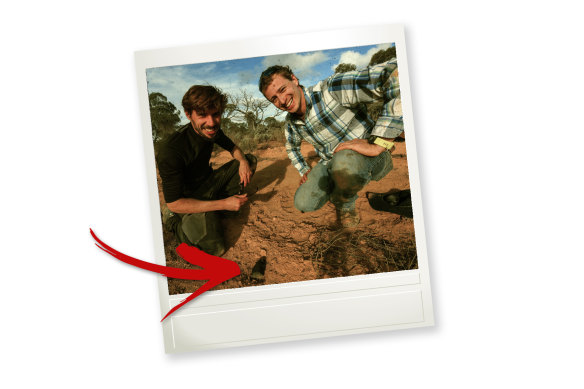 Scientists Anthony Lagain (left) and Hadrien Devillepoix (right) with the meteorite Devillepoix  found on the Nullarbor.