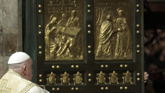 Pope Francis opens the Holy Door to mark the opening of the 2025 Catholic Holy Year, or Jubilee, in St Peter’s Basilica, at the Vatican on Christmas Eve.