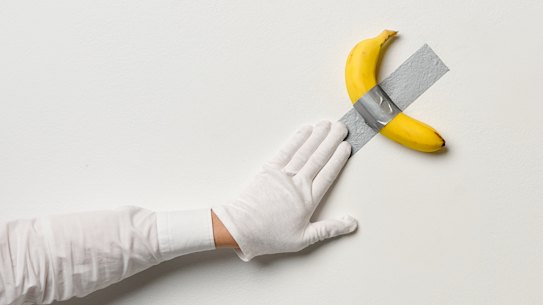 An NGV art handler with <i>Comedian</i>.