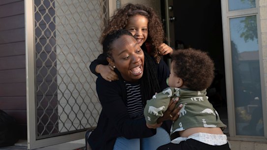 Dr Tinashe Moira Dune, academic at Western Sydney University, with her kids Naya, 5, and Yarran, 1 at their home in Bardia.