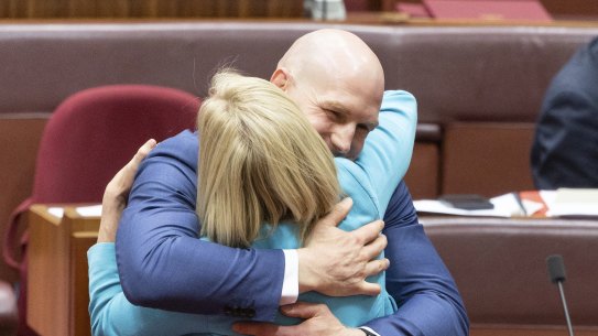 Senator David Pocock and Finance Minister Katy Gallagher embraced after the territory rights bill passed the senate on Thursday night.