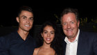 Cristiano Ronaldo, Georgina Rodriguez and Piers Morgan in Italy in 2019. Morgan says his recent interview with Ronaldo was a “game-changer” for his TV show.