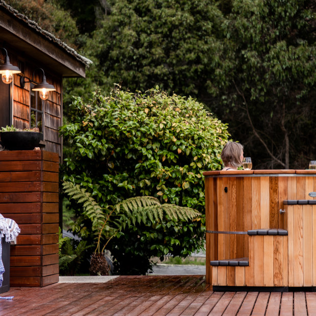 Set on a private deck, the Cedar Cottage hot tub fits four.