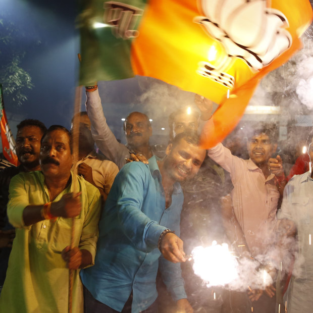Supporters of India's ruling Bharatiya Janata Party in Lucknow celebrate the revoking of Kashmir's special status.