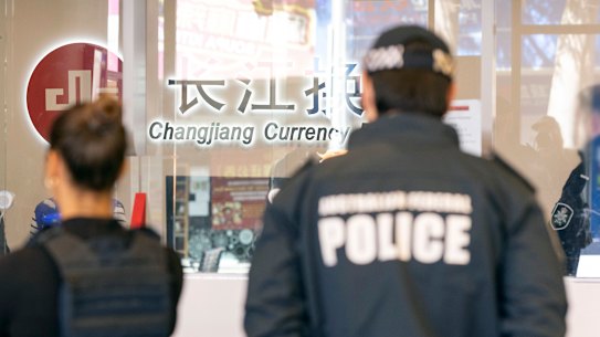 AFP officers raid a Changjiang branch in Sydney CBD.