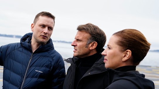 Macron (centre), Danish PM Mette Fredricksen (right) and Greenlandic PM Jens-Frederik Nielsen present a united front in Nuuk on Sunday.