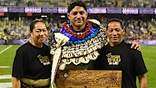 Jason Taumalolo with his parents.