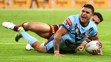 Blues star Latrell Mitchell goes over.