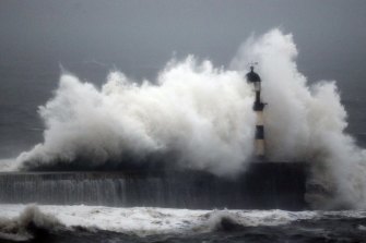Waves engulf the Seaham Lighthouse in Durham, England, in early 2016. Sea-level rises may be a lot more than currently predicted by climate models because they largely exclude ice sheet contribution.