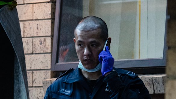 Police officers raid Mr el Matari's home.