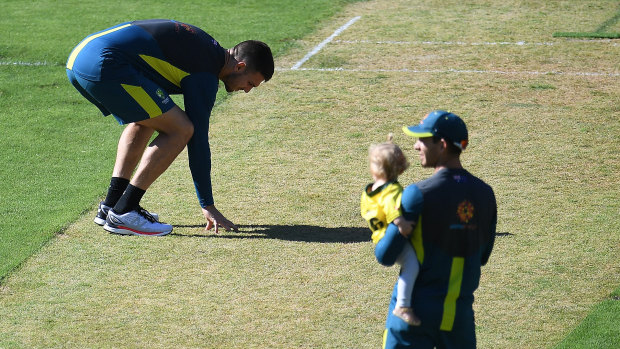 Mitch Marsh (left) and Tim Paine inspect the pitch on Christmas Day.