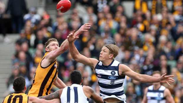 Tap off: Rhys Stanley (right) contests the ruck against Ben McEvoy during Geelong's round 18 loss to Hawthorn.