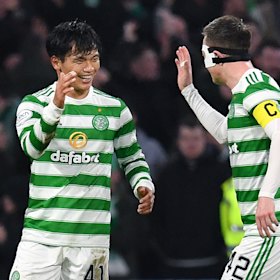 Celtic recruit Reo Hatate celebrates his second goal with skipper Callum McGregor.
