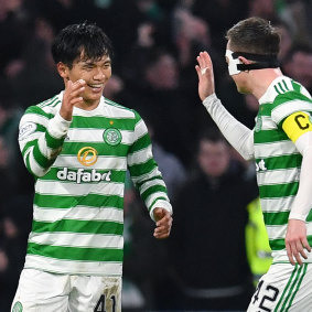 Celtic recruit Reo Hatate celebrates his second goal with skipper Callum McGregor.
