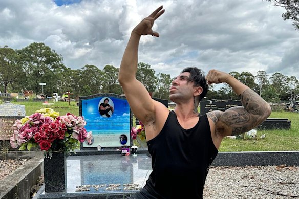 Aziz “Zyzz” Shavershian’s brother, Said Shavershian, strikes a classic “Zyzz” pose next to Aziz’s grave.