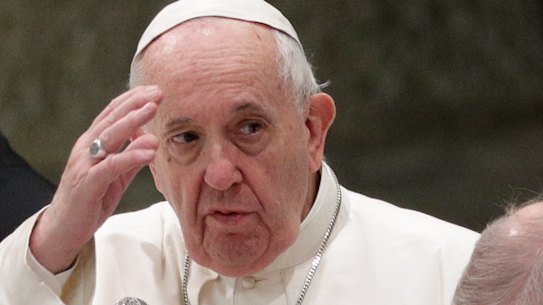 Pope Francis delivers his blessing during his weekly general audience in the Pope Paul VI hall.