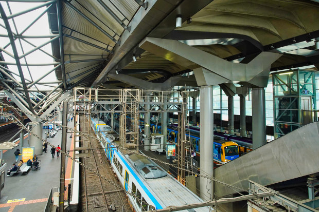 The undulating, wave-like roof on the left gives way to a flatter concrete roof on the right.