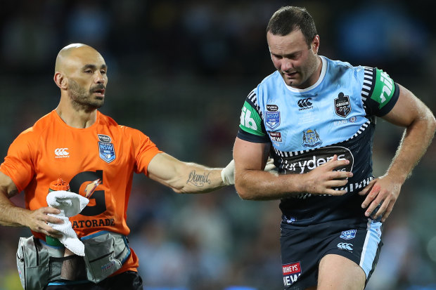 Boyd Cordner leaves the field in Adelaide after suffering a concussion.
