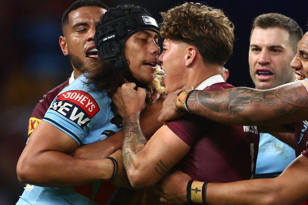 Jarome Luai and Reece Walsh lock horns during Origin two this year.