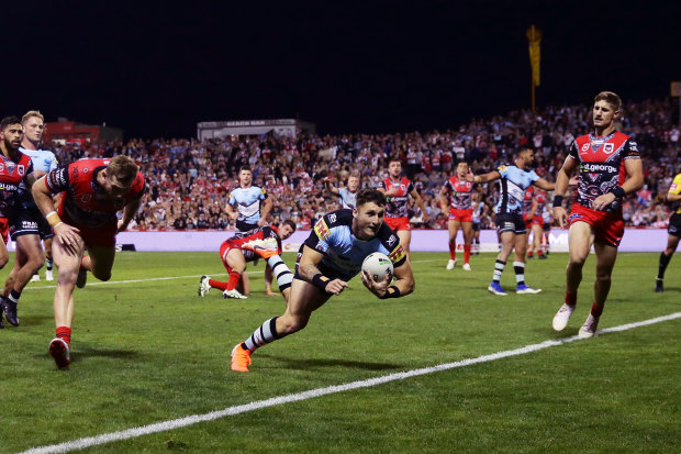 Bronson Xerri scores a try for the Sharks against the Dragons in 2019.