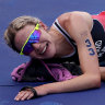 An emotional Cassandre Beaugrand celebrates her win in the women’s triathlon.