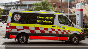 An ambulance arriving at Liverpool Hospital. Most of Saturday’s COVID-19 deaths were reported in south-west Sydney.
