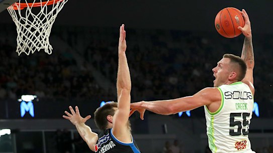 Mitch Creek throws down a dunk against Melbourne United.