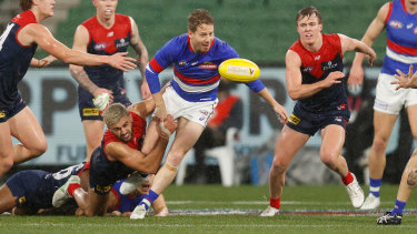 Lachie Hunter s tackled by Christian Salem.