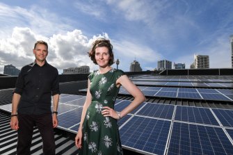 Allegra Spender (pictured with Andy Cavanagh-Downs) on the ICC rooftop in Darling Harbor with a 520 kW solar photovoltaic array.