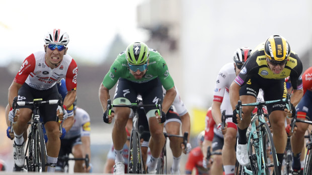 Three's a crowd: Caleb Ewan, left,   Peter Sagan, center, and  stage winner  Dylan Groenewegen fight out the finish of stage seven.