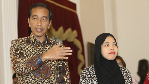 Siti Aisyah, right, met Indonesian President Joko Widodo, left, on her return home after murder charges against her were unexpectedly dropped.