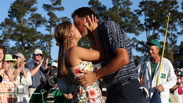 Scottie Scheffler and wife Meredith embrace after his Masters win.