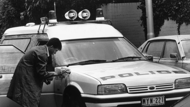 Forensics check for fingerprints after the shootings.