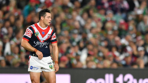 Playing through the pain: Cooper Cronk locked in his legacy by winning a premiership with a broken shoulder blade.