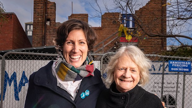 Jones and Caitlin Dullard in front of the remains of the theatre last year.