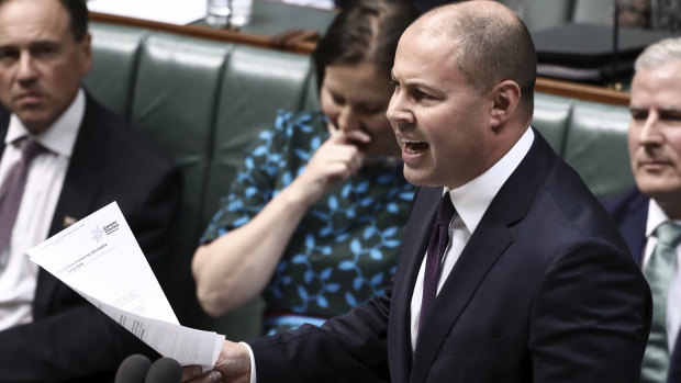 Treasurer Josh Frydenberg with the original letter from the Cancer Council on Wednesday.