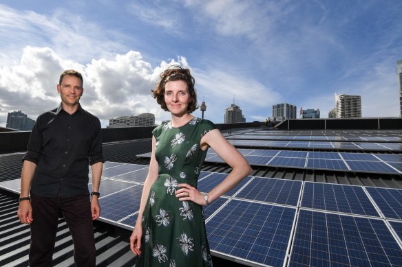 Allegra Spender (pictured with Andy Cavanagh-Downs) on the roof of the ICC at Darling Harbor with the 520kW rooftop, solar PV Array they managed to finance.