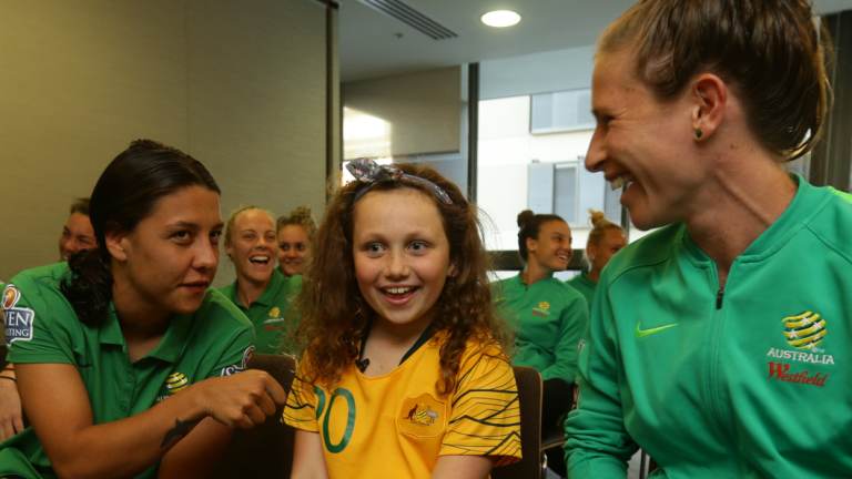 Starstruck: Fan Willow Bennett meets the Matildas in Newcastle.