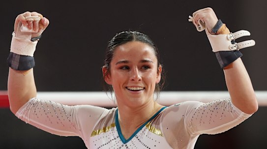 Kate McDonald celebrates her amazing uneven bar routine.