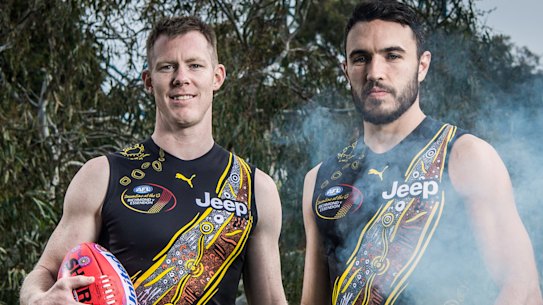 The Age, News, 26/05/2021 photo by Justin McManus.
Jack Riewoldt and Shane Edwards wearing Richmond Indigenous jumper designed collaboratively by the two of them in front of the canoe tree in Yarra Park at the MCG.
