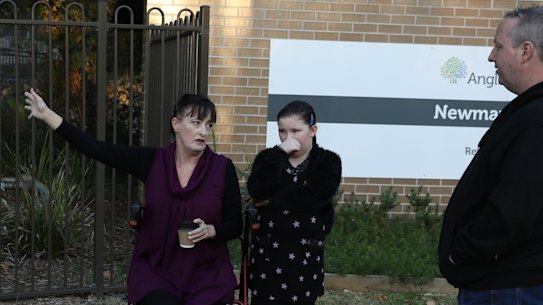 Relatives of Newmarch House residents outside the home on Tuesday. Liz Lane with daughter Samantha, and Anthony Bowe.  