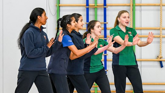 Avila students learning self-defence.