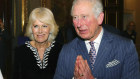 Prince Charles using the "namaste" greeting.