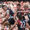 Brayden Maynard (left) and John Noble of Collingwood compete for the ball against Archie Perkins of Essendon in theÂ AnzacÂ Day match at the MCG on 25th April,Â 2023. Photo:Â PaulÂ Rovere
