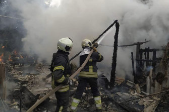 Ukrainian firefighters work to extinguish a fire at damaged residential building in Lysychansk at the weekend.