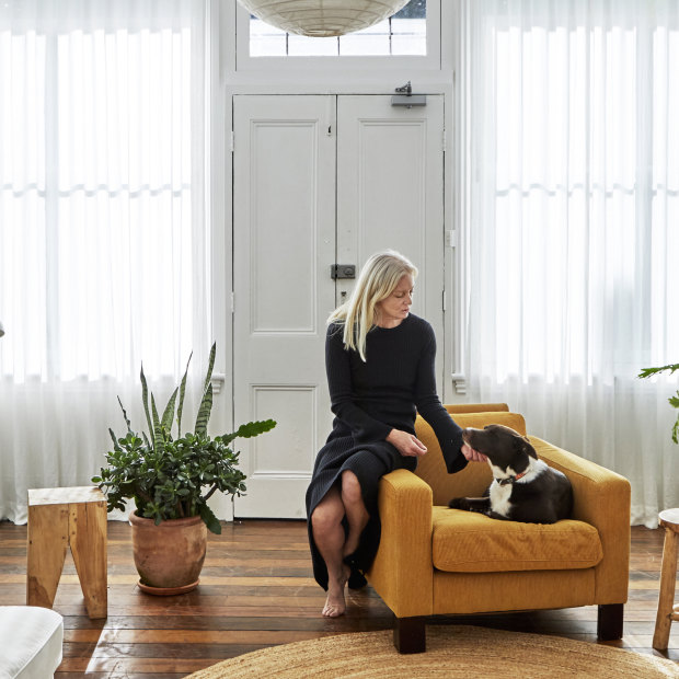 Cynthia describes the front room as “a versatile space that I can convert into a gallery when I have exhibitions”. The wooden stools are from InArtisan and the light shade is from The Society Inc.