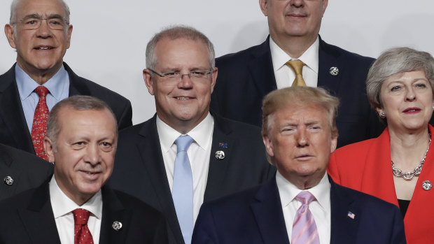 Turkish President Recep Tayyip Erdogan, Prime Minister Scott Morrison, US President Donald Trump and UK Prime Minister Theresa May during the 'family photo' at the G20 Summit in Osaka.