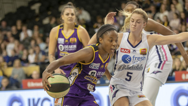 On guard: Boomers' star import Lindsay Allen drives to goal past Adelaide’s Aimie Clydesdale. 