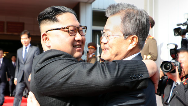 North Korean leader Kim Jong-un embraces South Korean President Moon Jae-in after their summit in the Demilitarised Zone on May 26.